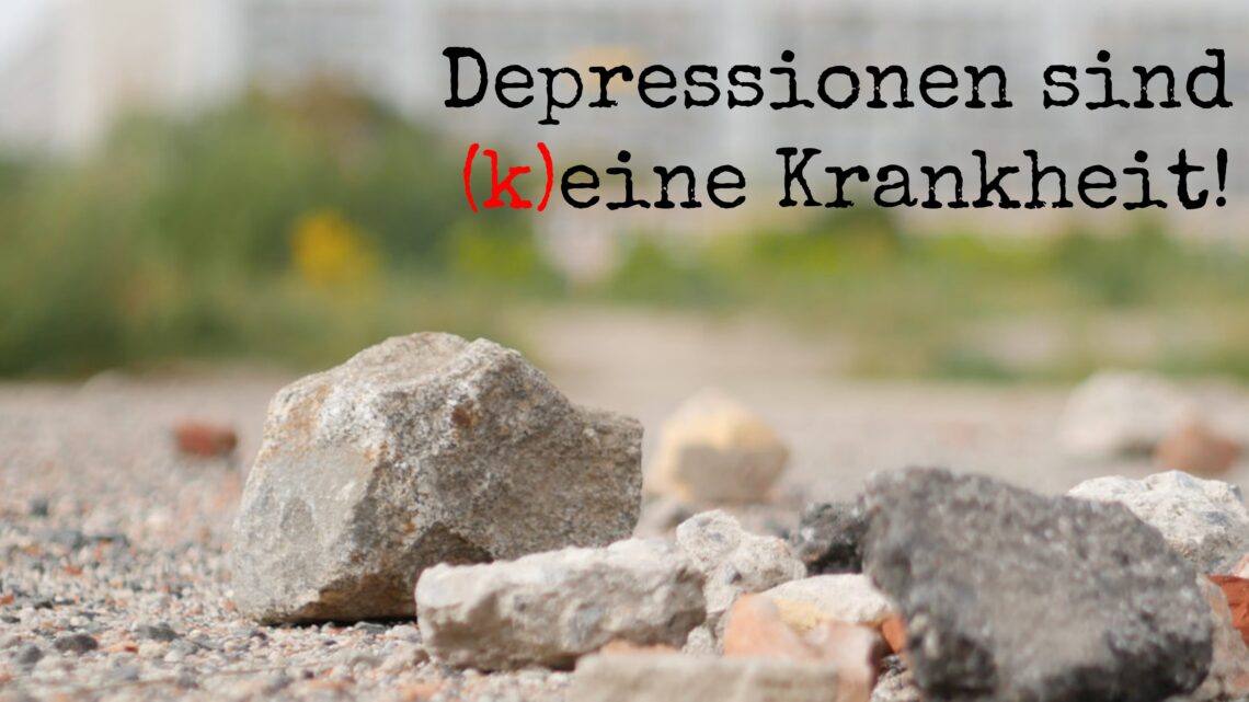 Steine auf einem Feld und darüber der Text "Depressionen sind (k)eine Krankheit!"